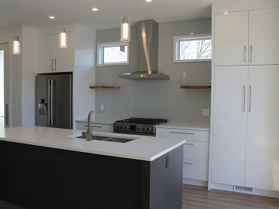 Kitchen backsplash with straight stack glass tile and floating shelves, laminate flooring